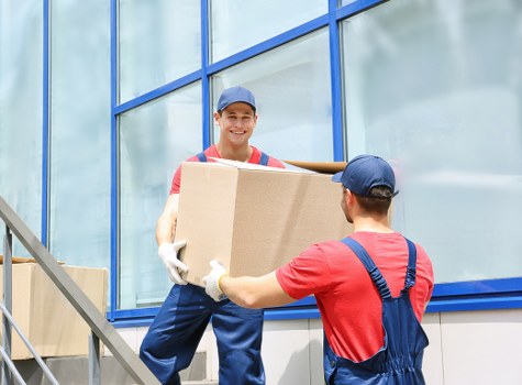 Removal van and moving crew planning a house move in Farringdon