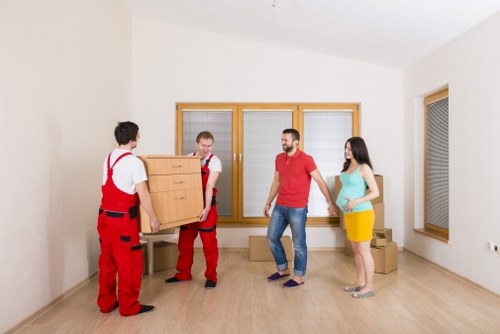 Loading furniture into a moving truck in central London