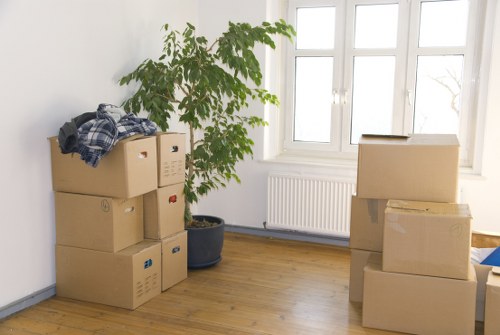 Packed boxes and furniture ready for a Farringdon moving van