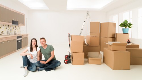 Careful wrapping of fragile belongings for a move in Farringdon