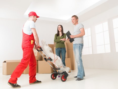 Professional movers handling desks and IT equipment in Farringdon